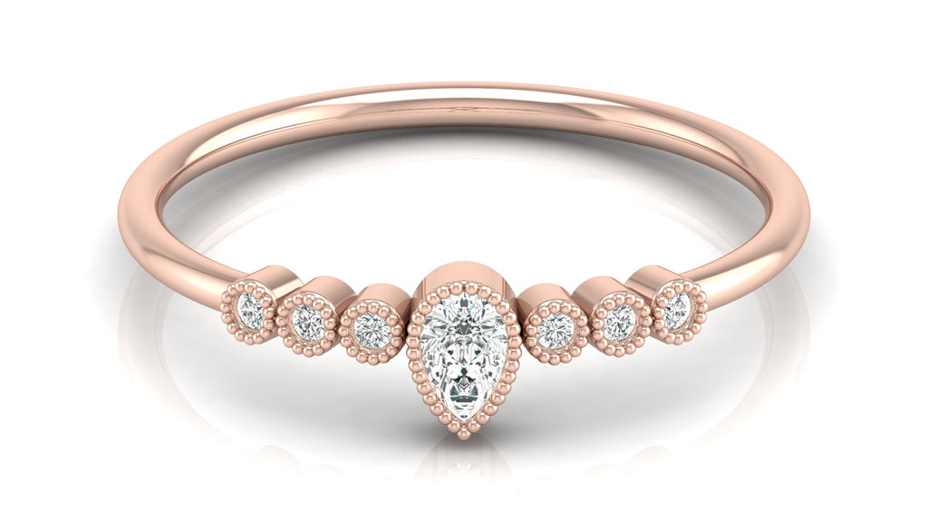 0.04 +0.09  Ct Round + Pear Diamond Ring