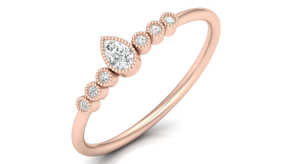 0.04 +0.09  Ct Round + Pear Diamond Ring